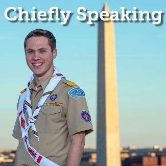 The National Chief Zach Schonfeld standing next to the washington monument.