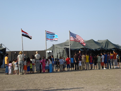 A flag ceremony on the Victory Base in Iraq led by the Scouting program in Baghdad.